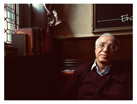 Egyptian man sitting in old London pub